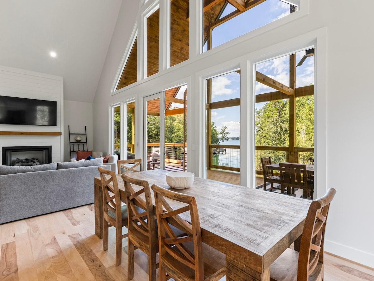 Dining area for 10 with a wonderful view of the lake through the A-Frame design. 